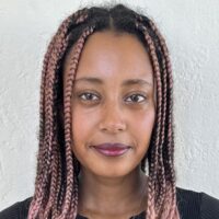 <b>Mahlet Shiferaw - 2026 Wonderfest Science Envoy</b> <br> <p>Mahlet Shiferaw is a PhD candidate in physics at Stanford University, where she is advised by Dr. Risa Wechsler. Mahlet studies large-scale structure formation, which means that she tries to model how galaxies, clusters of galaxies, and quasars came to form over time. Because of the vast scales involved in her research, Mahlet typically analyses huge datasets spanning billions of light-years, where she looks for meaningful statistical trends in how clustered these objects are, and how they are related to dark matter. Understanding this connection is essential for building a complete cosmological model of the Universe. When she is not doing research, Mahlet loves to draw and paint, run, and explore San Francisco.</p> Mahlet Shiferaw - 2026 Wonderfest Science Envoy