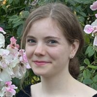 <b>Natalie LeBaron - 2026 Wonderfest Science Envoy</b> <br> <p>Natalie LeBaron is a 4th-year PhD student in the Astronomy Department at UC Berkeley. She studies the visible and near infrared light from supernova explosions of massive stars to learn about the elements and molecules they synthesize and interact with. This work informs understanding of how the chemical composition of our solar system and the Earth came to be as newer stars like our Sun are formed out of the dust produced by supernovae and older stars. Natalie is passionate about science outreach, mentorship, and removing barriers within STEM education. Outside of science, she enjoys sci-fi, exploring state parks, and spending time with her cat.</p> Natalie LeBaron - 2026 Wonderfest Science Envoy